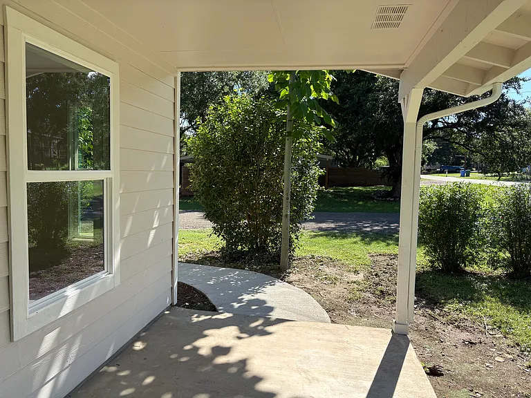 Sidewalk to paved driveway