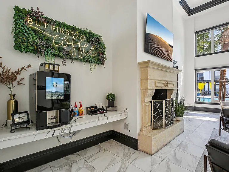 Enjoy a warm cup of coffee in the stylish resident coffee bar at Providence Uptown, Houston's premier apartment community.
