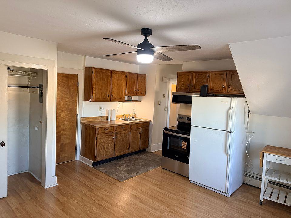 Kitchen from a different angle. shows closet, entry door, and sink