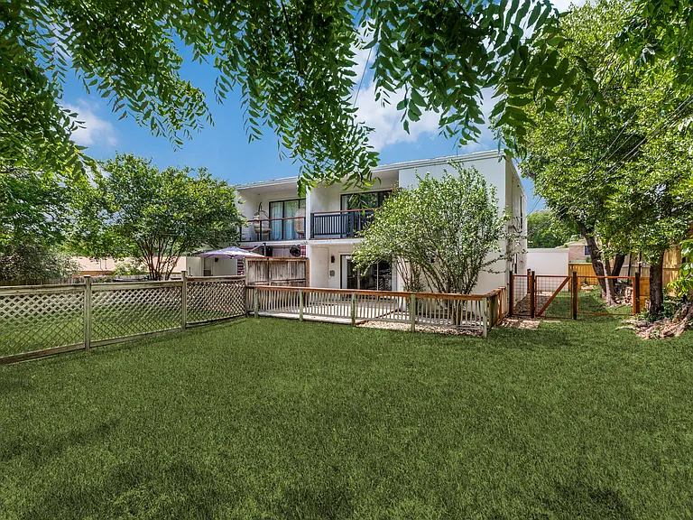 upstairs primary suite balcony
downstairs covered pation and deck
fenced backyard