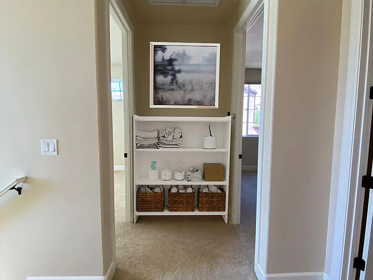 Upstairs hallway with convenient for storage and easy access to all bedrooms.