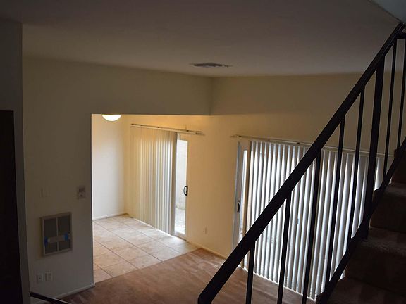 Photo from stairway into living then dining area.