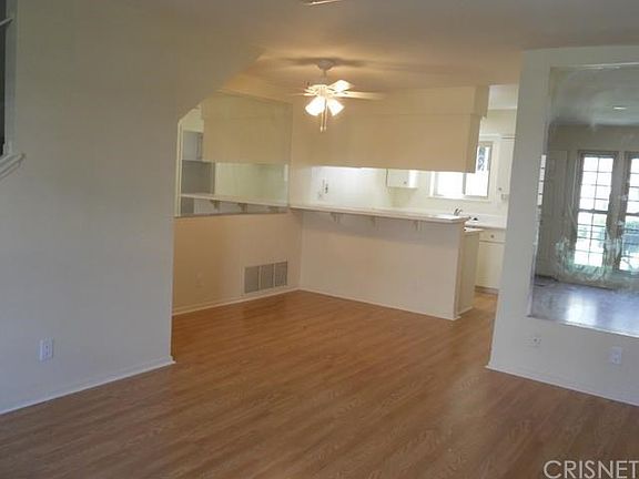 Newly upgraded with new flooring, paint.  Ready to start living in this open townhouse.  Dining area and breakfast bar look into kitchen.