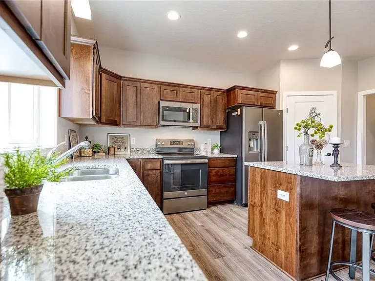 Very Nice Kitchen With Granite Counter Tops and Walk In Pantry.