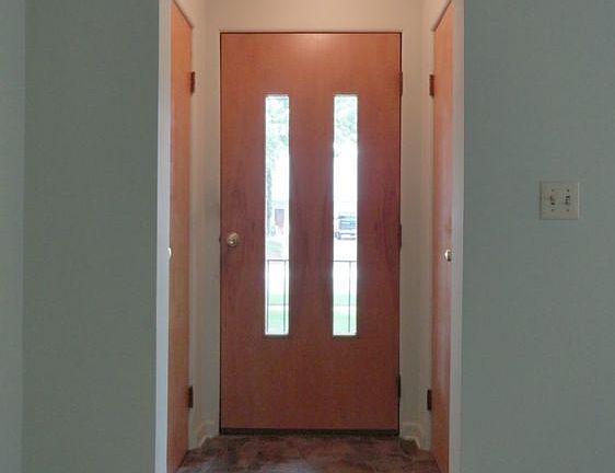 As one steps inside they'll first be greeted by this entrance foyer with a handy coat closet on either side, and attractive vinyl stone look easy care flooring!