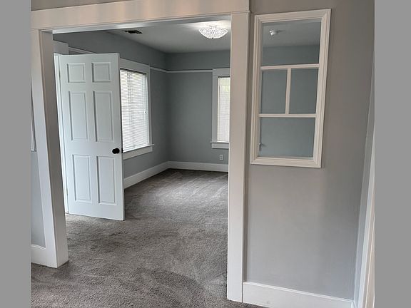 View From Dining Room into Living Room and Front Door