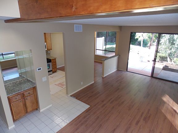 View from stairs to bar, dining and living spaces.