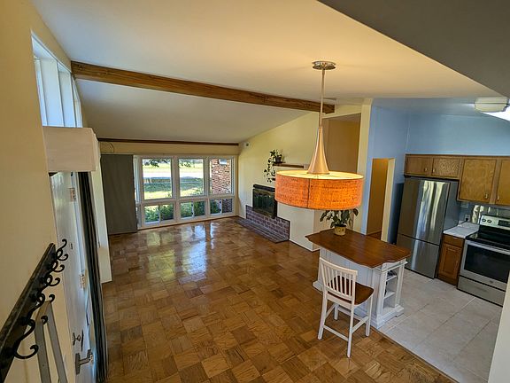 Left Angle: Dining Area + Living Room in the back