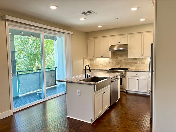 Bright east-facing kitchen with top of the line appliances and granite countertops