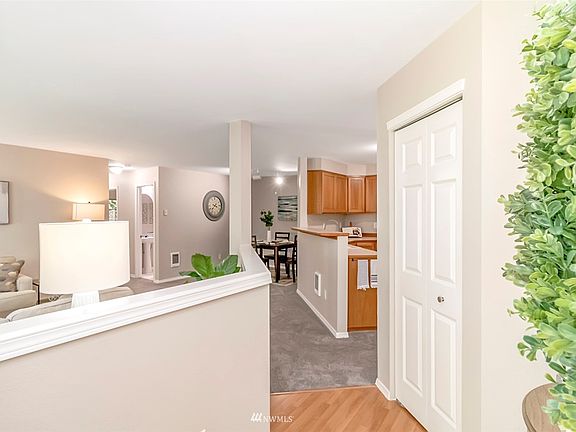 Entry way with large coat closet/storage and room for an entry table or bench