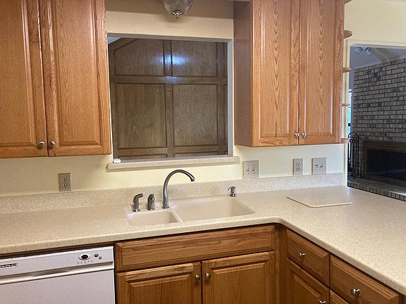 sink and counters with view into living room