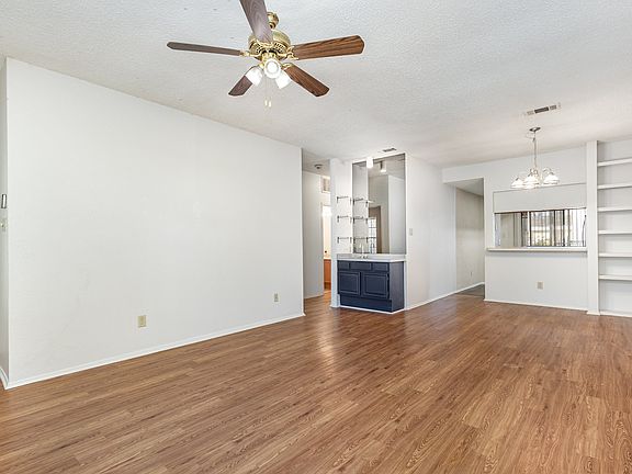 Living room with dining area and wet bar.