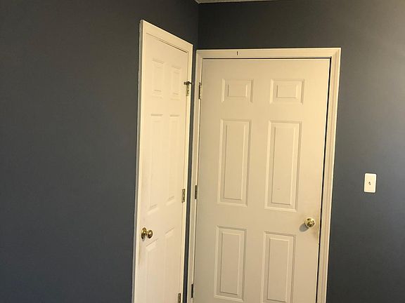 Pantry door (on left) door to garage (on right). 1/2 of the garage space will be yours. Garage was not photographed for tenant privacy.