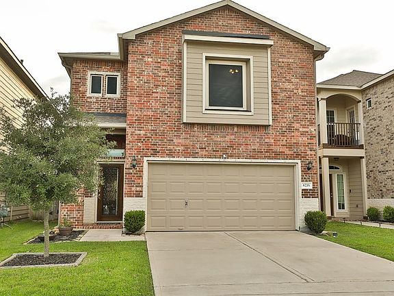 Two car garage that is very organized and double wide driveway.
