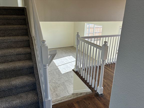 This is tri-level home with a finished basement. Stairs going up to thee bedrooms and going down to the family room and door to the backyard.
