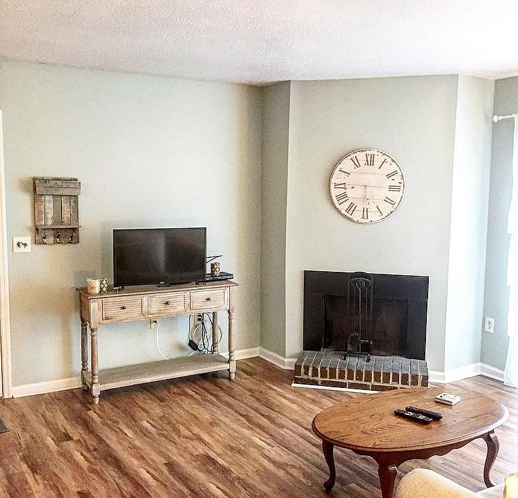 Living room with wood burning fireplace