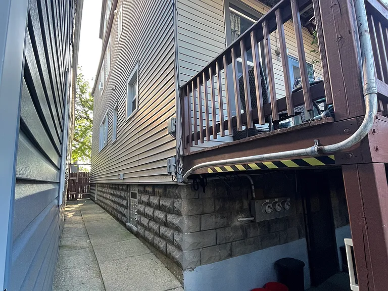 Gangway between our house and the neighbors to the south - entrance to the basement, where the laundry is