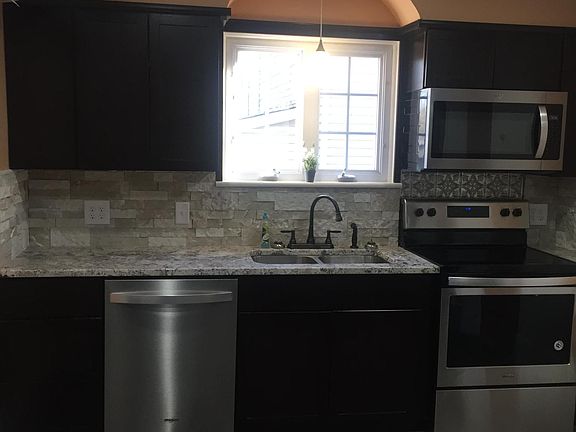 Granite counters with air stone backsplash. Recessed lighting with dimmer switch.