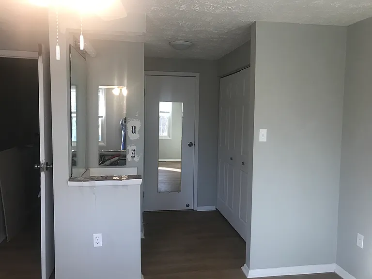 Master suite with mirror and vanity