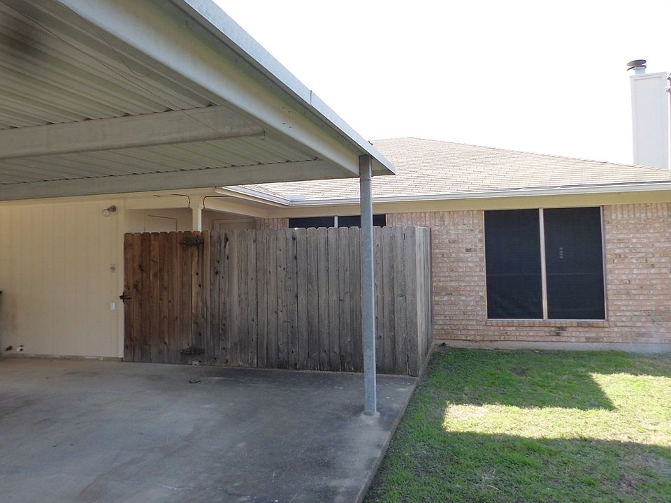 Carport and enclosed patio with storage closet