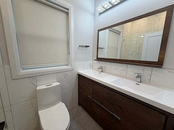 Primary bedroom - en suite full bathroom with double vanity.