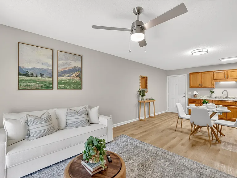 Living room with wood-inspired flooring at Saddlebrook Apartments in Murfreesboro, TN