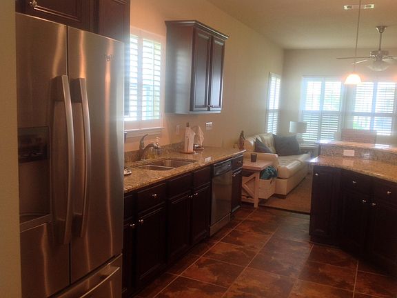 Kitchen with eat in bar area overlooking the family room.
