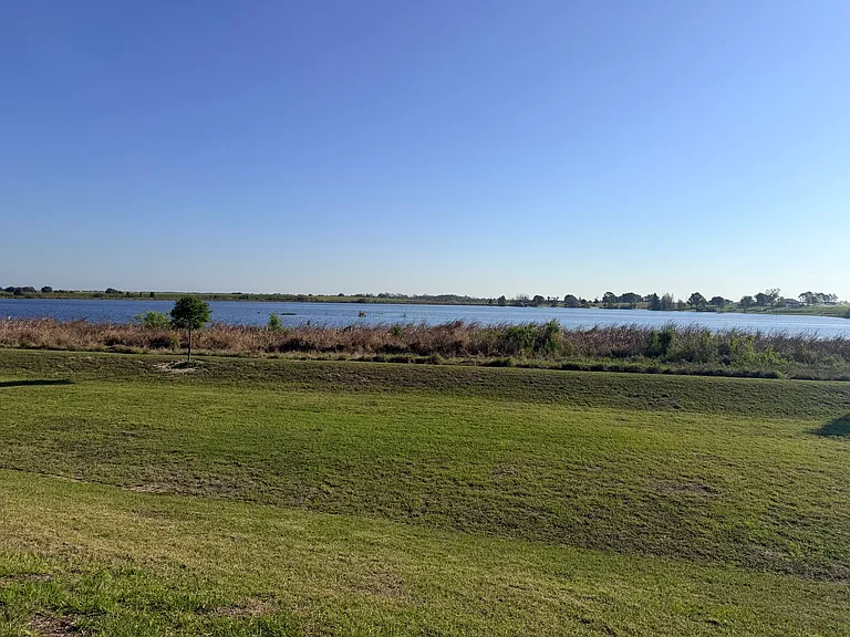 Large back yard, with private lake view.