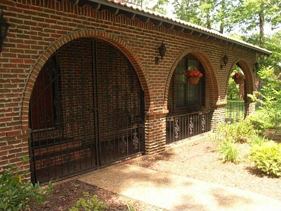 "Covered front porch features a gated entry."