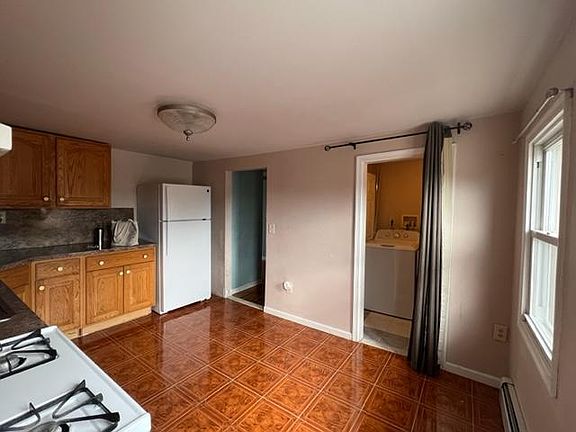 Kitchen with view to Laundry (on right).