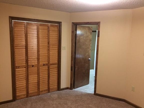 Downstairs bedroom w/ carpet