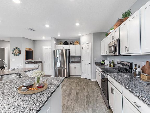 Your spacious new kitchen offers natural lighting, a pantry, and your choice of finishes - Wesley ll