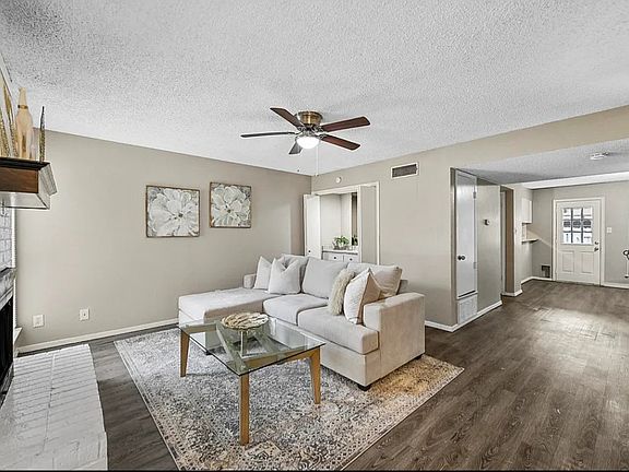 Living room with fireplace and bar 
(photo from previous listing)