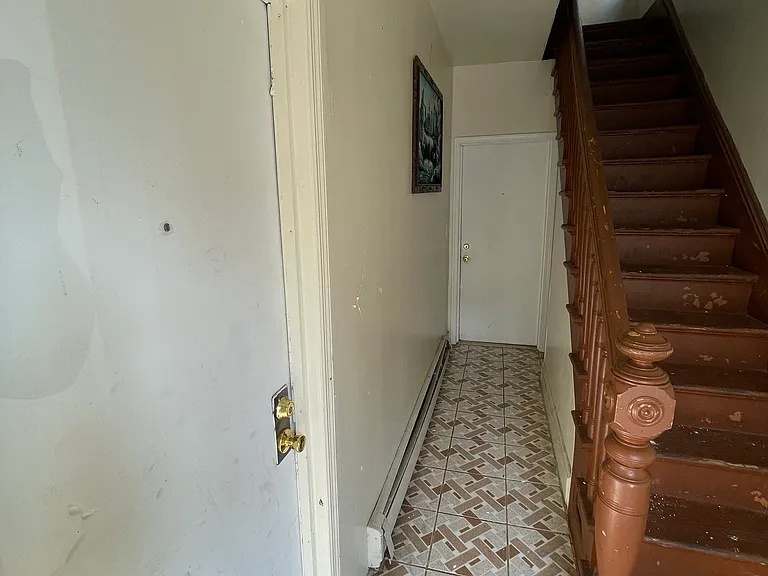 Main entrance, door to the left and end of hallway both lead to this apartment.