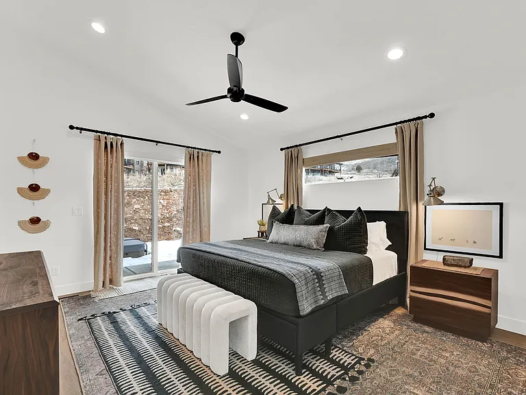Master bedroom with French doors to access back patio with piped gas firepit and private hot tub.