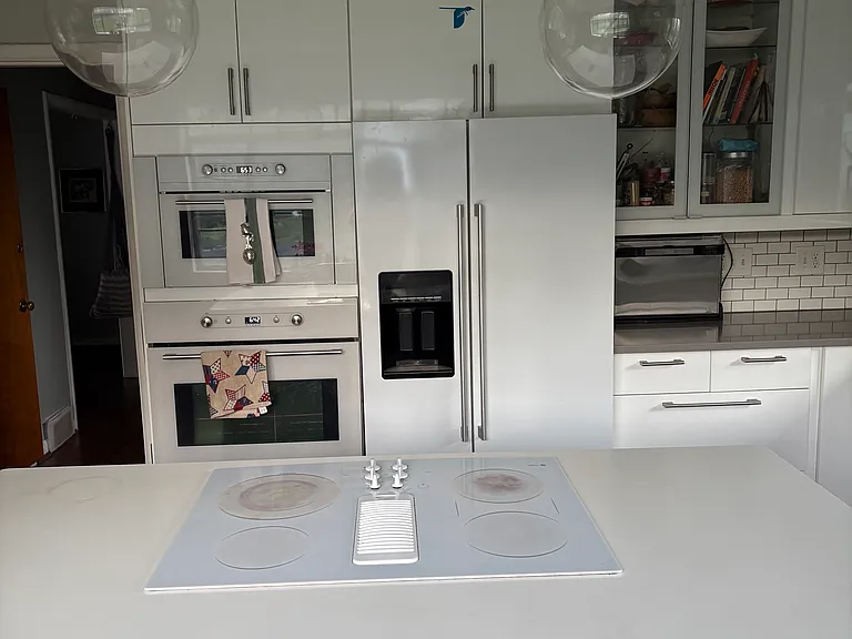 Fully renovated kitchen with quartz countertops, built in microwave, large farmhouse sink with Island