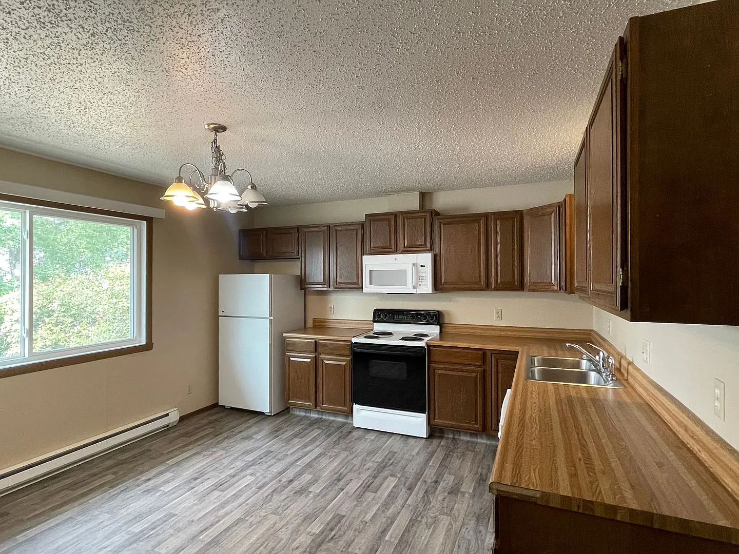 Spacious 2BR/1.5BA Townhome | Garage | Private Yard | In-Unit Laundry — Photo 4