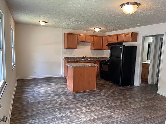 Open Living Room with kitchen and dining area