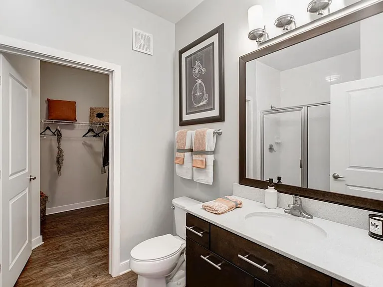 Spa-like luxury awaits with a spacious bathroom vanity layout and modern finish details.