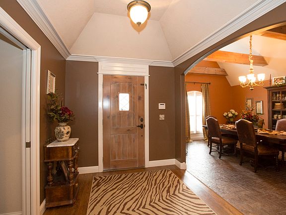 Vaulted entry w/decorative door