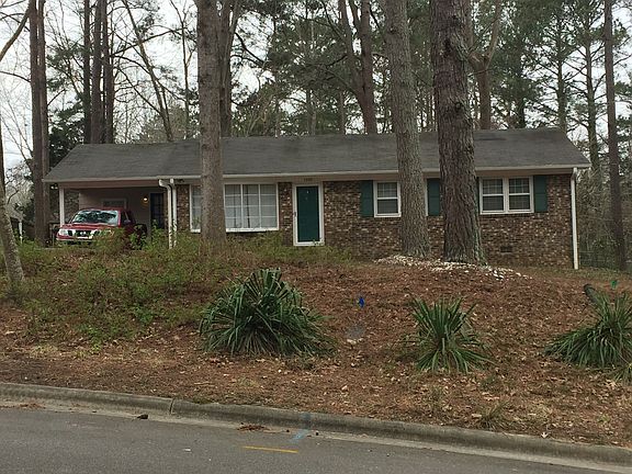 Three bedroom, three bath,
 brick ranch, with laundry room.