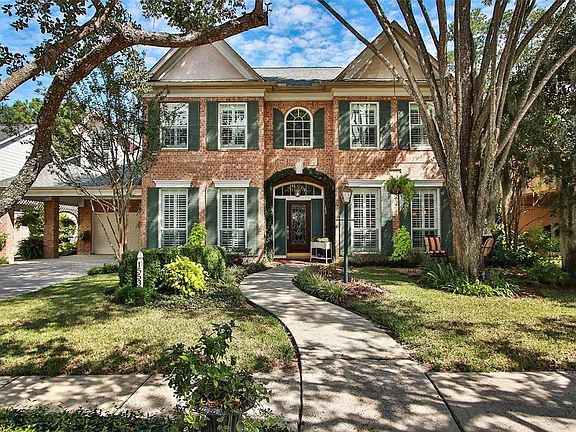 Imagine driving up daily to this beautiful view of your new memory maker. Amazing classic design is accented by lush, perfectly manicured, fully landscaped yard, and towering trees.
