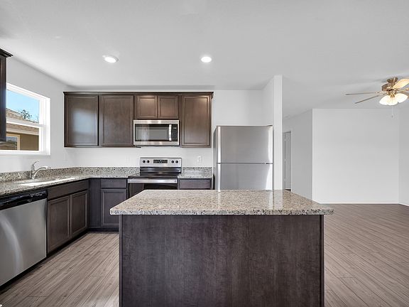 This move-in ready home features gorgeous granite countertops in the kitchen