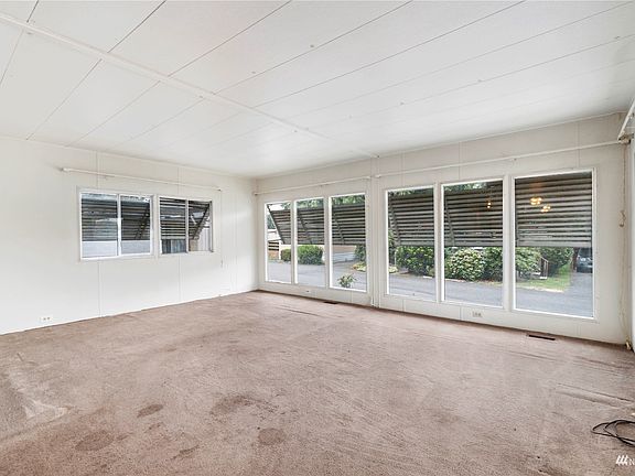 Living room with large windows throughout>