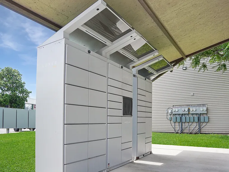 Secure package locker system for resident deliveries at Borders Apartments Brownsville TX.