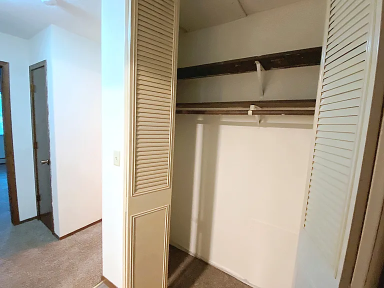 Entry closet with doors open