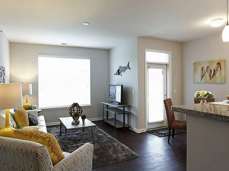 Natural light, hardwood-inspired floors, and an easy flow from room to room_this open-concept layout feels just right.