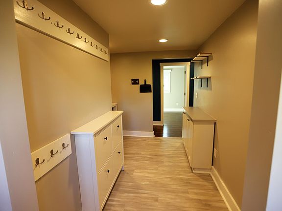 Laundry/utility room, viewed from mud room. Bed 3 entrance beyond hallway.