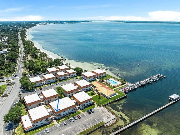 Unit R103 has direct bay view and stunning sunsets. Private parking in front of unit.