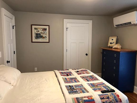 Private bedroom with queen bed, walkin closet and stackable washer/dryer in unit
